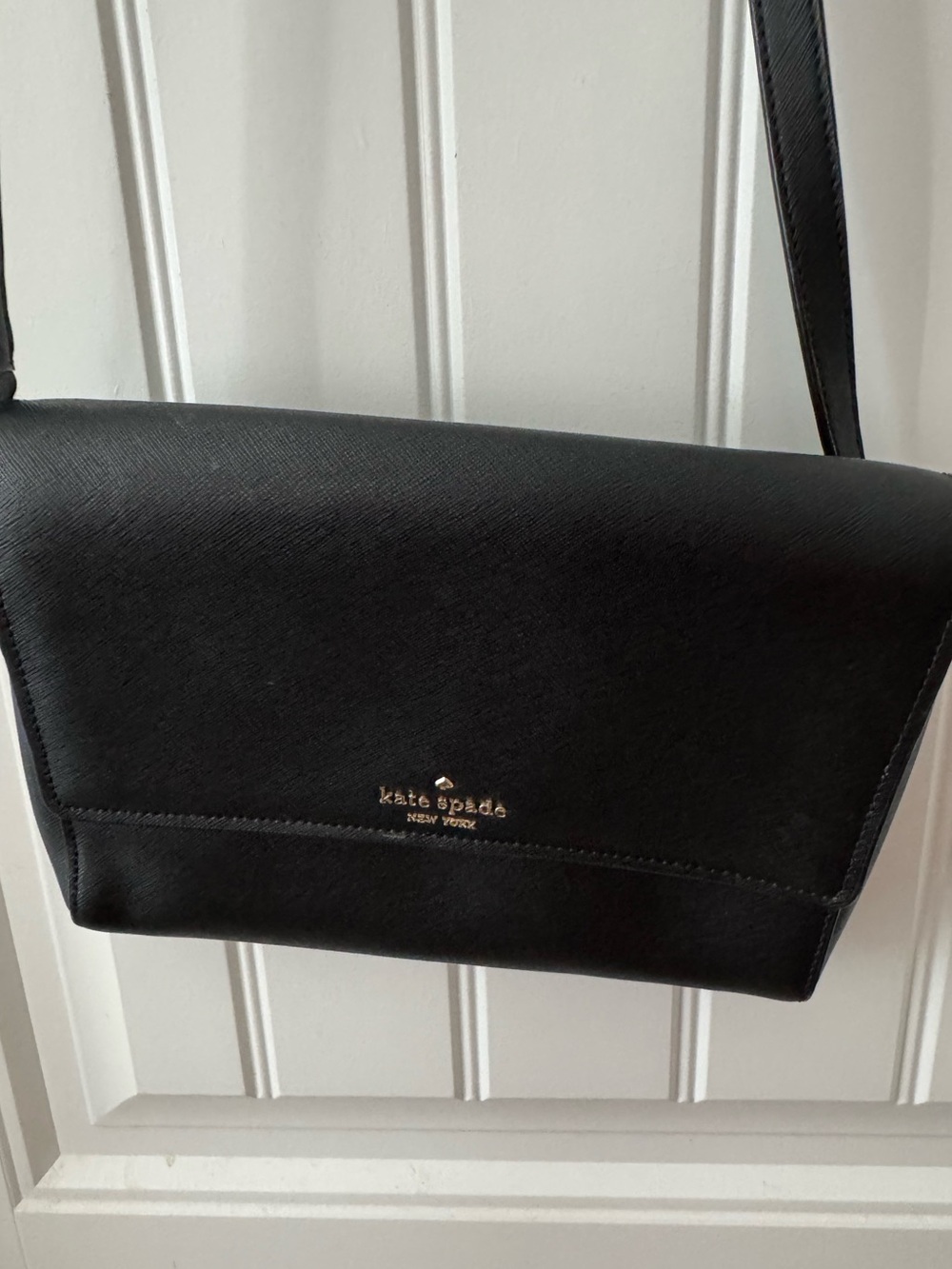 kate spade black leather flap crossbody with gold logo